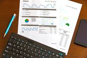 Datasheets next to a keyboard and pen