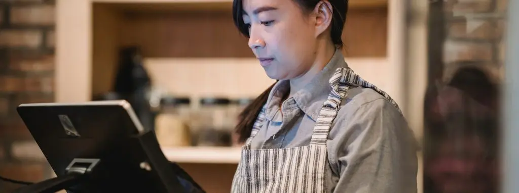 Waiter at a cash register